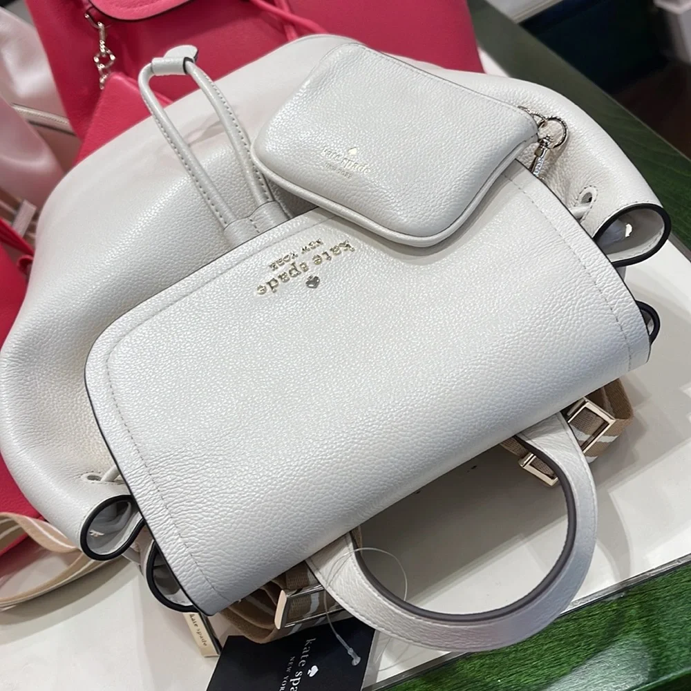 Kate Spade Rosie Medium Flap Backpack 
K8714 pebbled leather Parchment rosie
NWT - Picture 9 of 16